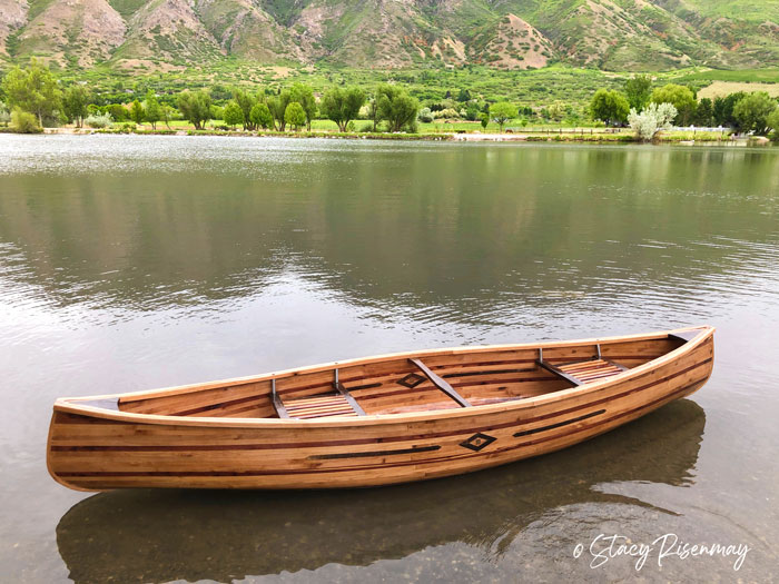 wood canoe on the water
